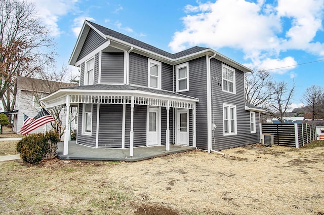 exterior space with central AC and a porch