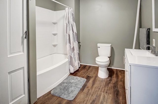 full bathroom with shower / tub combo with curtain, vanity, wood-type flooring, and toilet