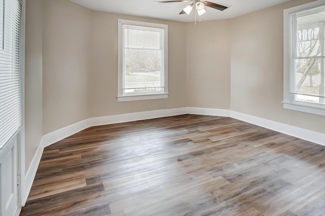 unfurnished room with ceiling fan and wood-type flooring