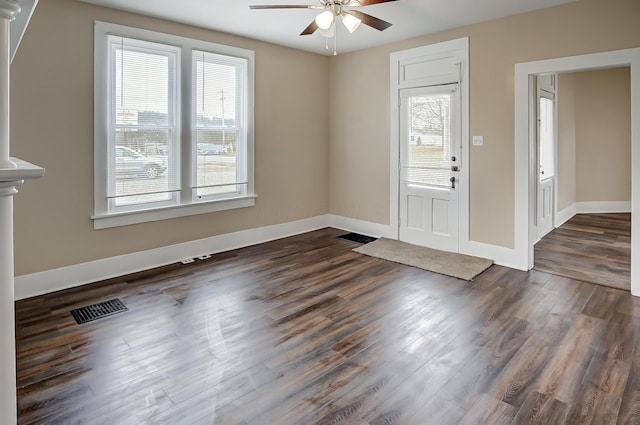 foyer entrance featuring dark hardwood / wood-style floors and ceiling fan