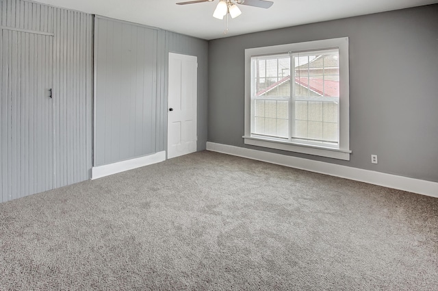 unfurnished bedroom with a closet, ceiling fan, and carpet