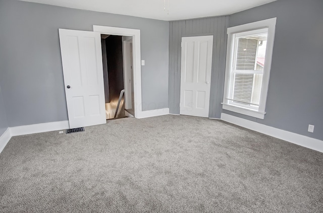 unfurnished bedroom with carpet flooring