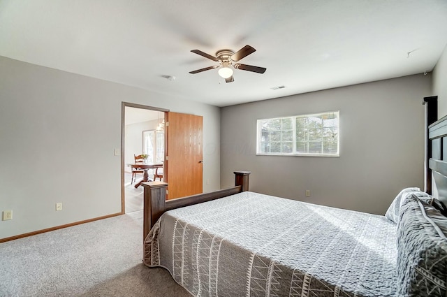 bedroom featuring ceiling fan and light carpet