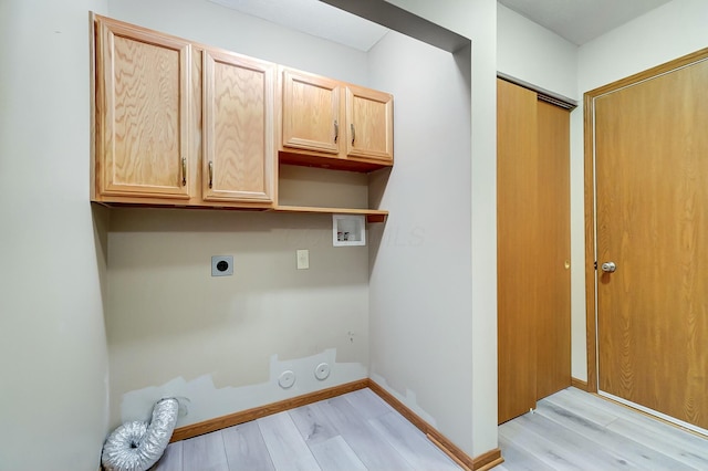 laundry area with cabinets, electric dryer hookup, washer hookup, hookup for a gas dryer, and light hardwood / wood-style floors