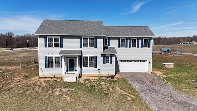 4021 County Road 124, Cardington, OH 43315 - colonial-style house with gravel driveway, a front yard, a shingled roof, and a garage