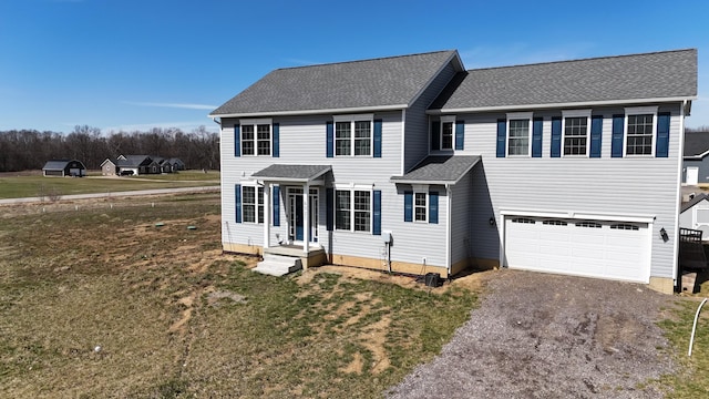 4021 County Road 124, Cardington, OH 43315 - view of front of home with a front lawn, roof with shingles, a garage, and aphalt driveway