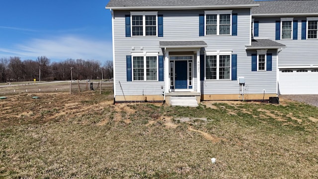 4021 County Road 124, Cardington, OH 43315 - view of front of home featuring a front yard, a shingled roof, an attached garage, and driveway