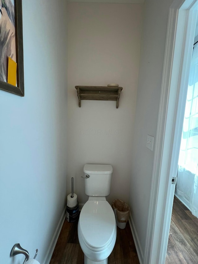 4021 County Road 124, Cardington, OH 43315 - bathroom featuring baseboards, toilet, and wood finished floors