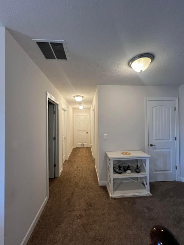 4021 County Road 124, Cardington, OH 43315 - hall with dark carpet, baseboards, and visible vents
