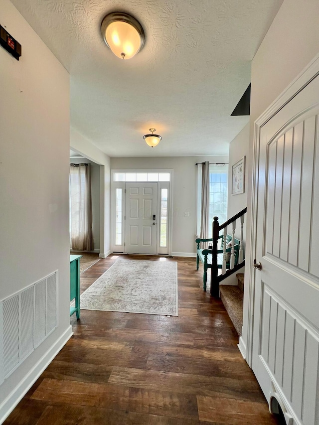 4021 County Road 124, Cardington, OH 43315 - foyer with visible vents, a textured ceiling, stairway, and wood finished floors