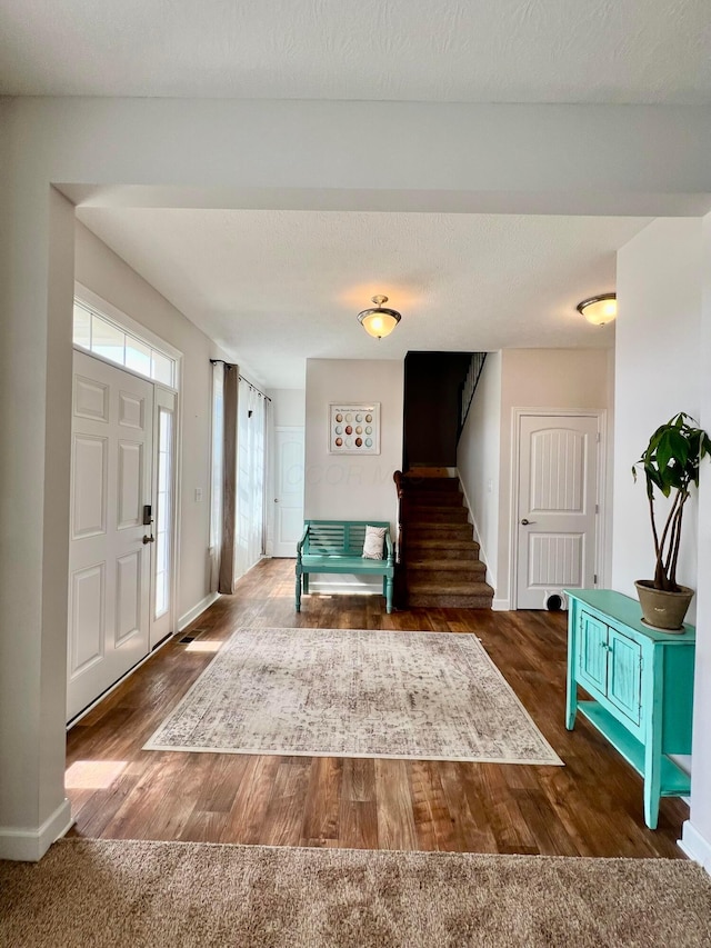 4021 County Road 124, Cardington, OH 43315 - entryway featuring baseboards, a textured ceiling, wood finished floors, and stairway