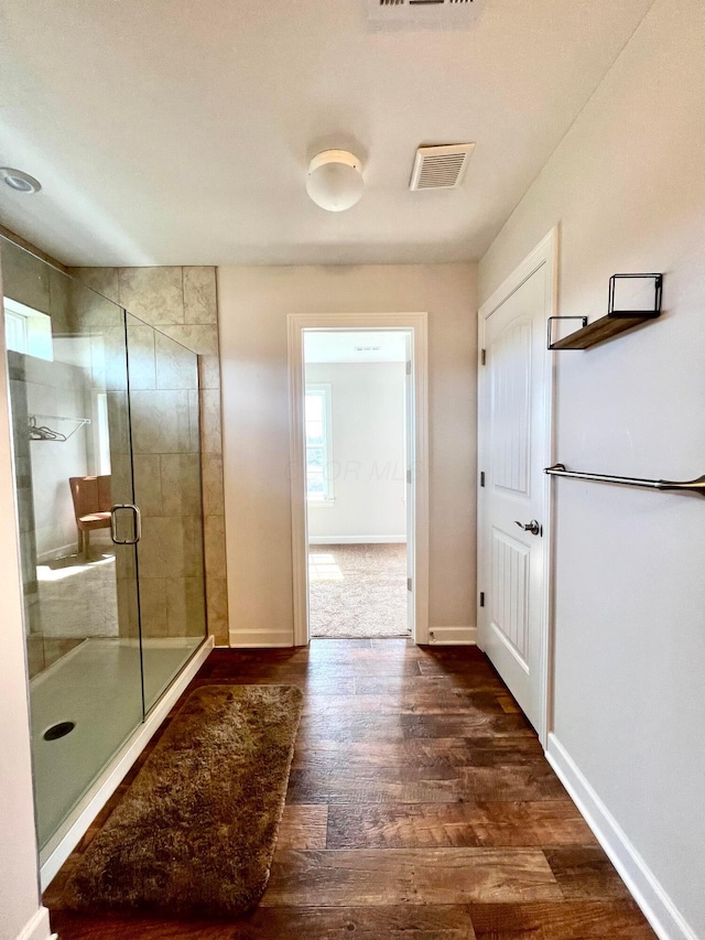4021 County Road 124, Cardington, OH 43315 - bathroom featuring wood finished floors, a stall shower, baseboards, and visible vents