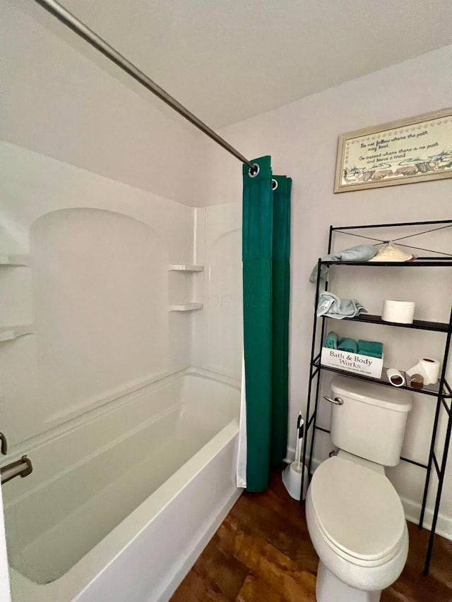 4021 County Road 124, Cardington, OH 43315 - bathroom with toilet, shower / tub combo, wood finished floors, and baseboards