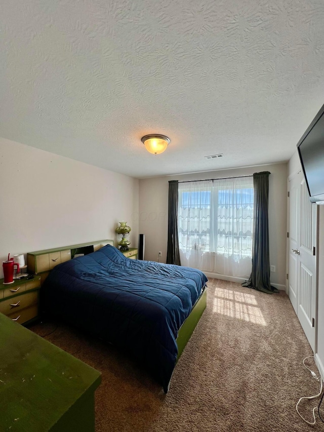 4021 County Road 124, Cardington, OH 43315 - bedroom with carpet, baseboards, a textured ceiling, and visible vents
