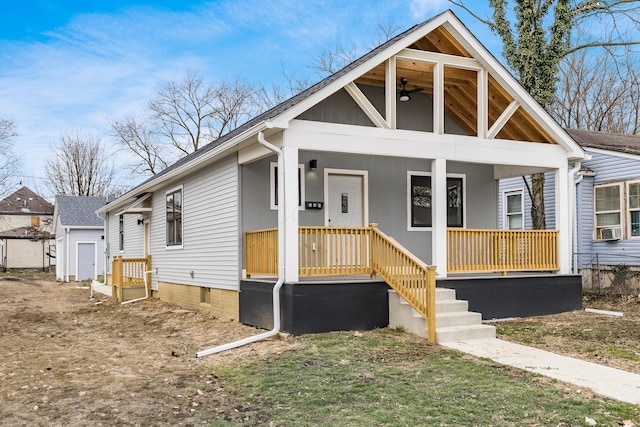 bungalow-style house with covered porch, ceiling fan, and cooling unit