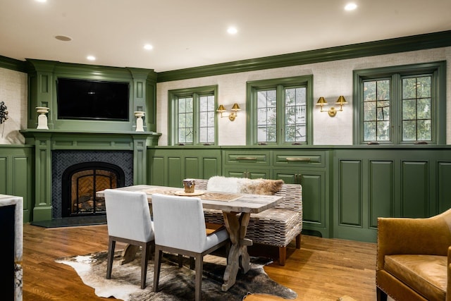 sunroom featuring a tile fireplace