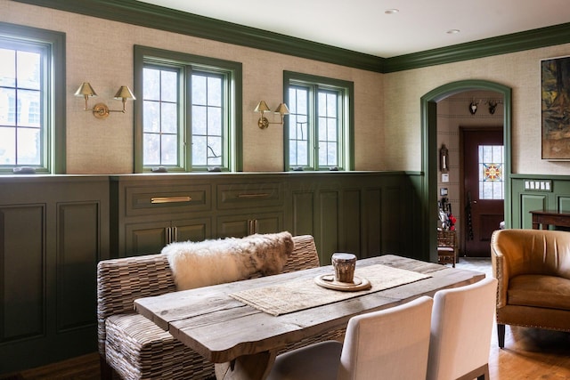 dining room featuring crown molding and wood-type flooring