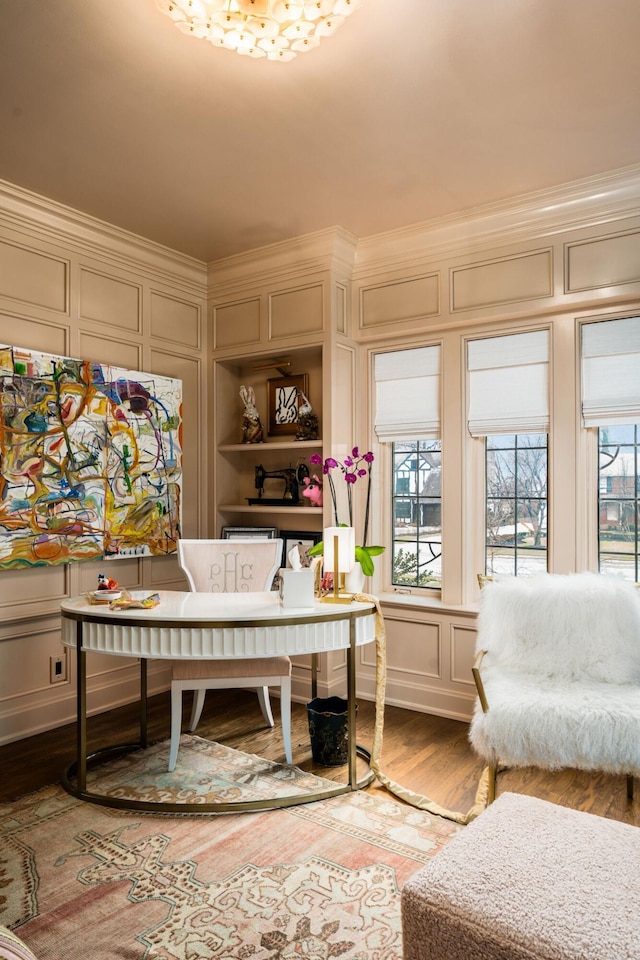 office area with hardwood / wood-style flooring and ornamental molding