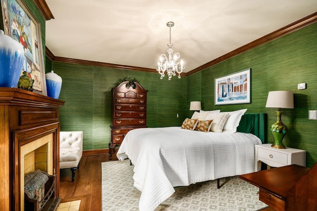 bedroom featuring crown molding, wood-type flooring, and an inviting chandelier