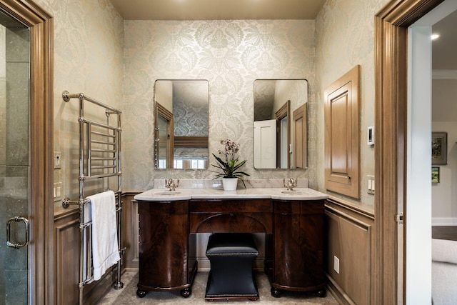 bathroom featuring vanity and a shower with door