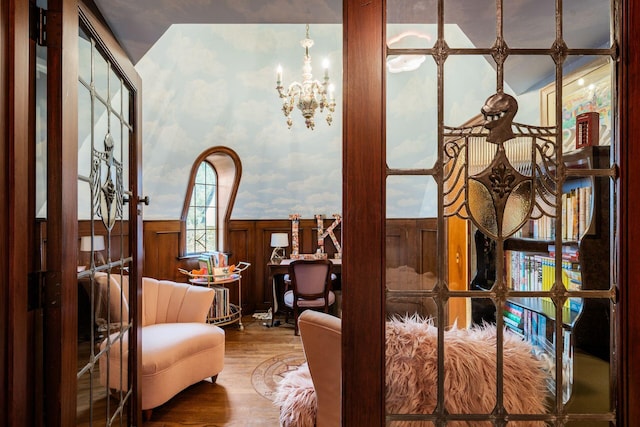 sitting room featuring hardwood / wood-style flooring and a notable chandelier