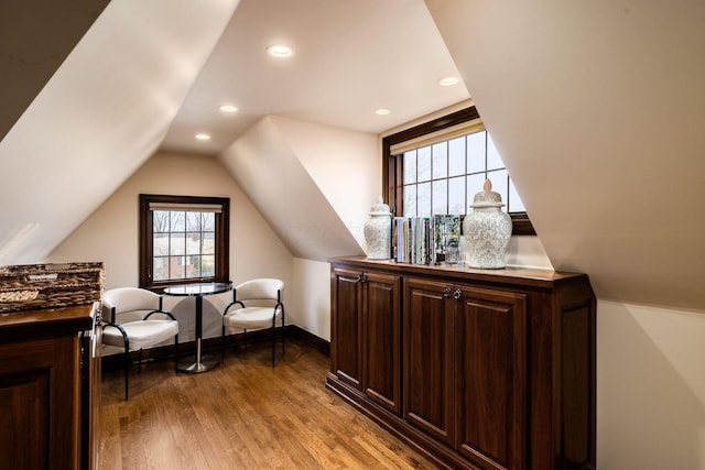 bonus room featuring vaulted ceiling and light hardwood / wood-style floors