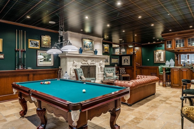 game room with crown molding, bar, a high end fireplace, and billiards