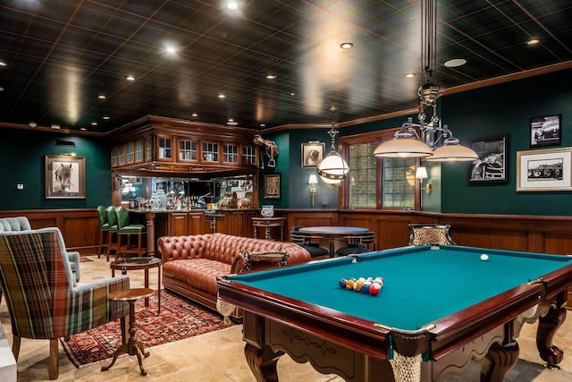 recreation room featuring crown molding, billiards, and bar area