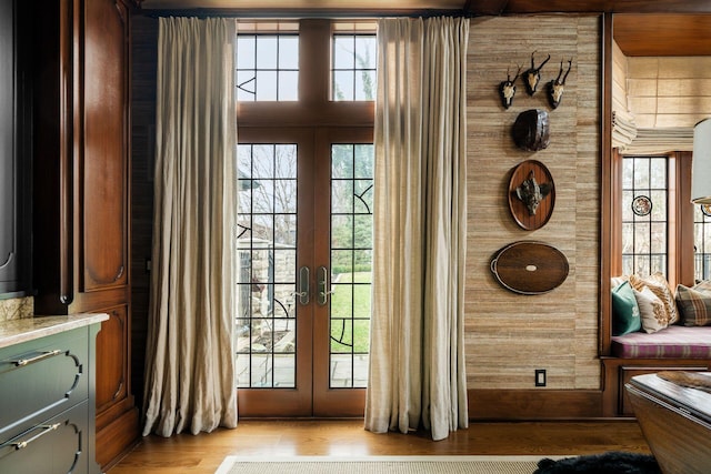 doorway to outside featuring french doors and light wood-type flooring