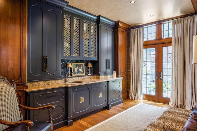 2528 Tremont Rd, Columbus, OH 43221 - indoor bar with french doors, light wood finished floors, plenty of natural light, and recessed lighting