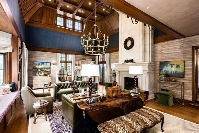 2528 Tremont Rd, Columbus, OH 43221 - living room featuring a chandelier, a large fireplace, beam ceiling, plenty of natural light, and wood finished floors
