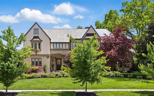 2528 Tremont Rd, Columbus, OH 43221 - english style home with stone siding, stucco siding, a front lawn, and a high end roof