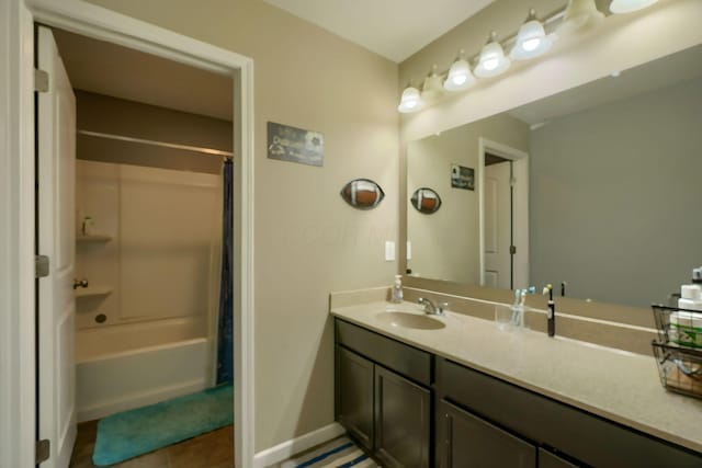 bathroom with vanity, tile patterned flooring, and shower / bath combo