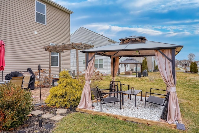 view of yard featuring a gazebo, a pergola, and a patio