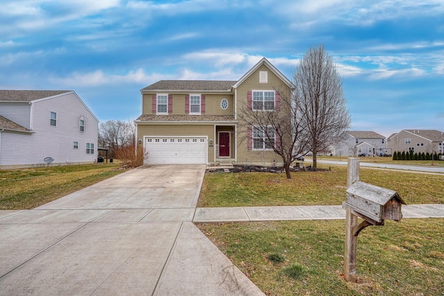 view of front of property with a garage and a front lawn