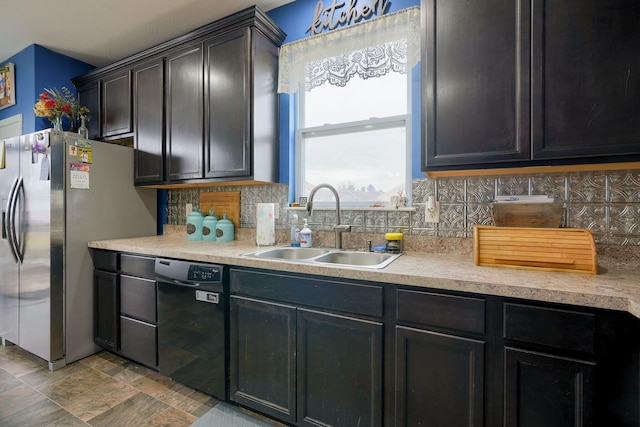 kitchen featuring sink, decorative backsplash, black dishwasher, and stainless steel refrigerator with ice dispenser