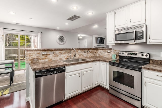 kitchen with sink, stainless steel appliances, and white cabinets