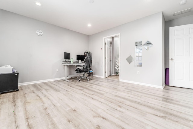 unfurnished office with light hardwood / wood-style floors