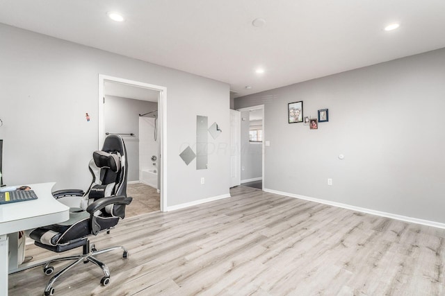 unfurnished office featuring light hardwood / wood-style floors