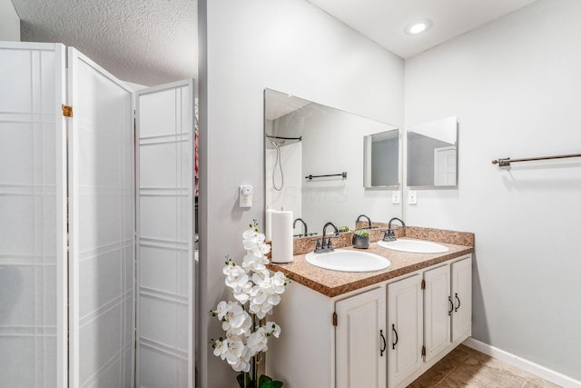 bathroom with vanity and tile patterned floors