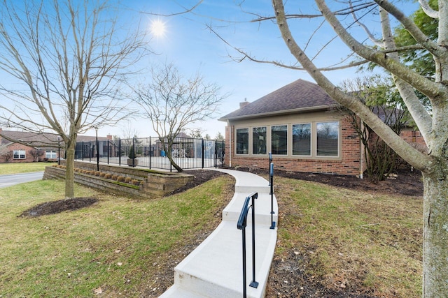 view of side of property featuring a lawn