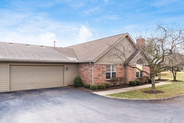 single story home with a garage