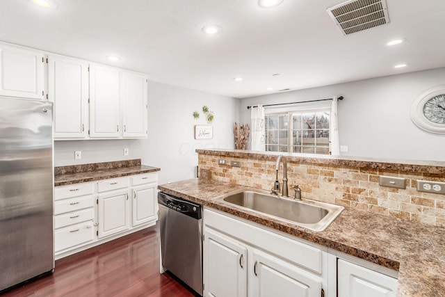 kitchen featuring sink, dark hardwood / wood-style floors, white cabinets, and appliances with stainless steel finishes