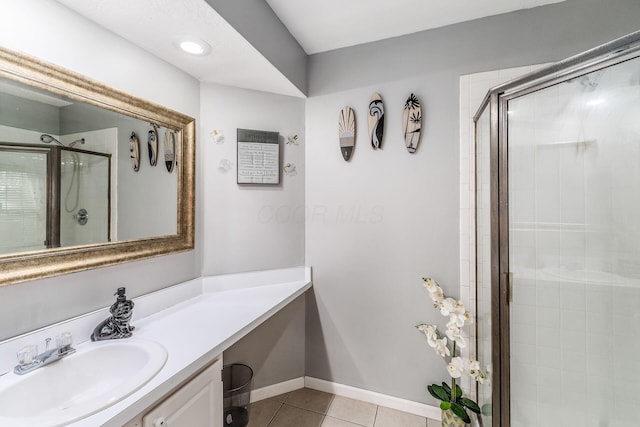 bathroom featuring vanity, an enclosed shower, and tile patterned flooring