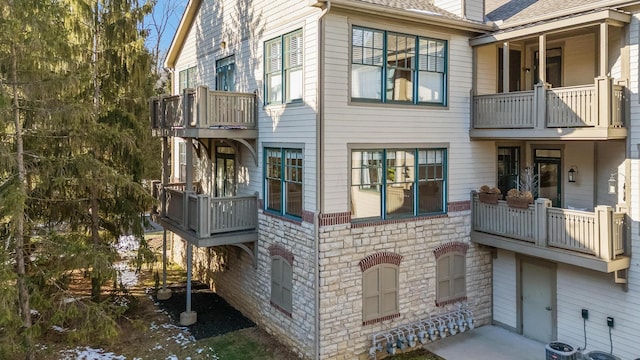 view of side of property featuring central AC