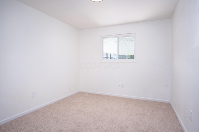 unfurnished room featuring carpet floors