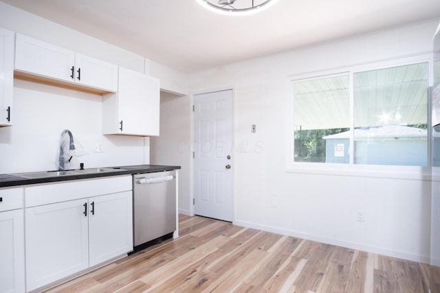 kitchen featuring white cabinetry, dishwasher, sink, and light hardwood / wood-style floors