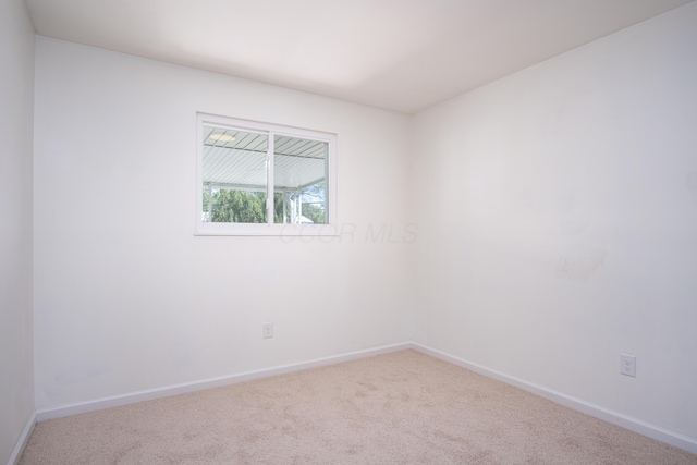 empty room featuring carpet flooring