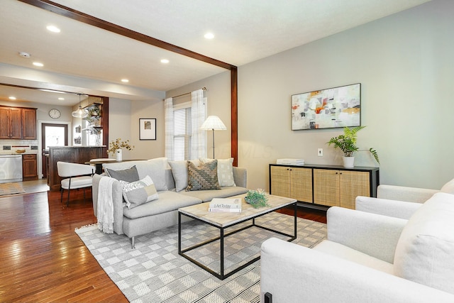 living room with a wealth of natural light and hardwood / wood-style floors