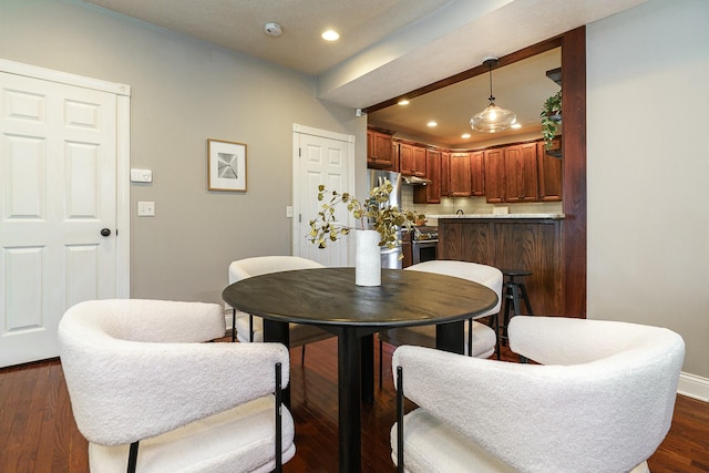 dining room featuring dark wood-type flooring